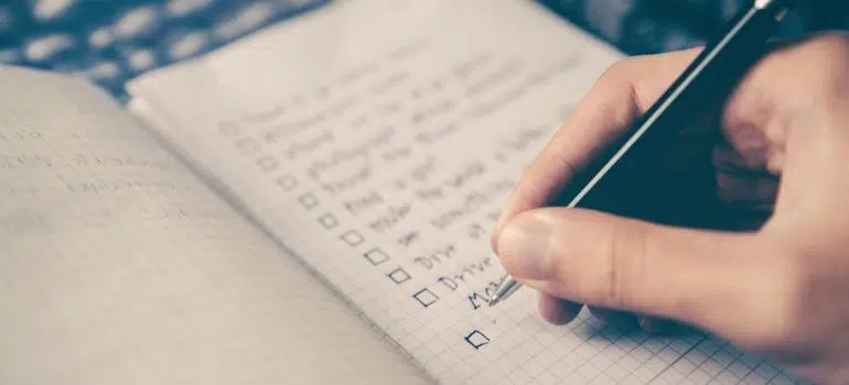 a person writting a checklist